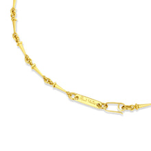 Gold chain necklace on a white background